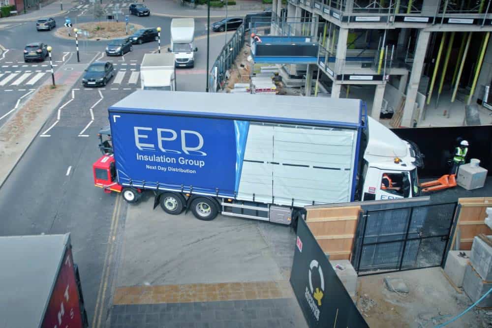 EPD delivery truck at urban construction site.