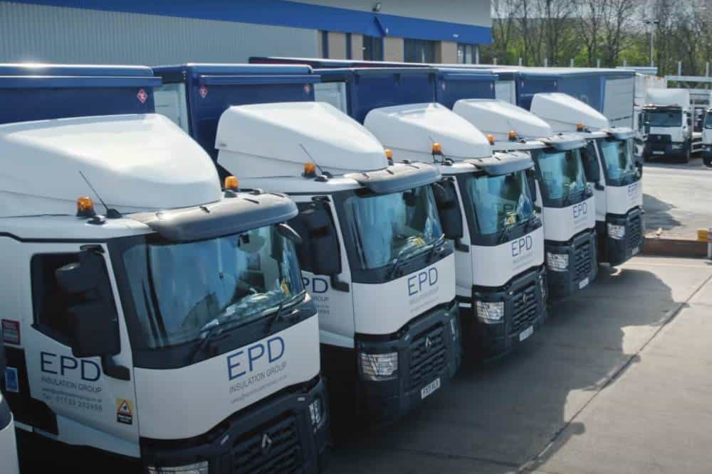 EPD lorry fleet parked outside company warehouse.