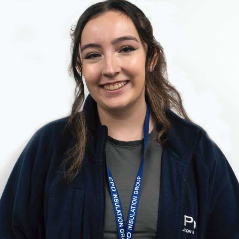 Smiling woman wearing lanyard and fleece jacket