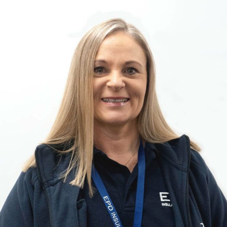 Smiling woman in company uniform against white background.