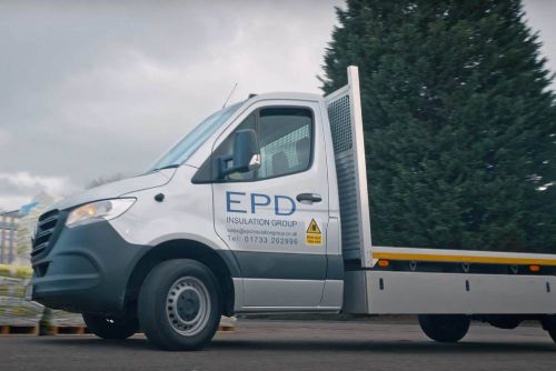 EPD Insulation Group van driving past trees.