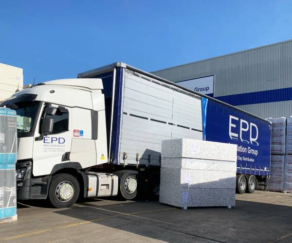 Lorry loading insulation materials at EPD warehouse.