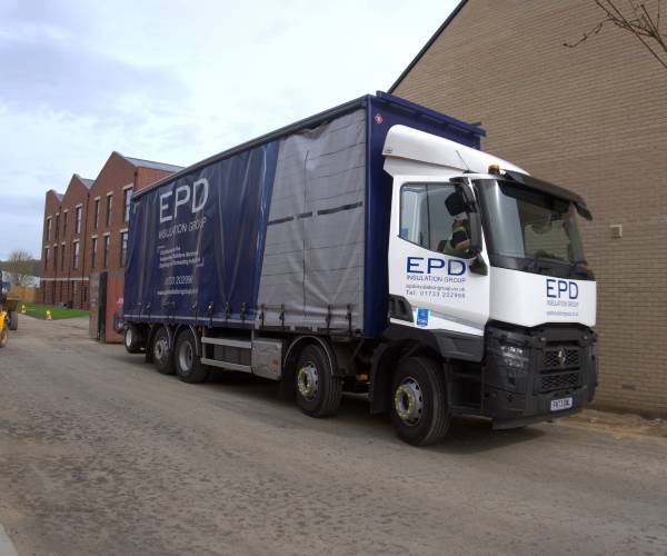 EPD lorry navigating urban area.