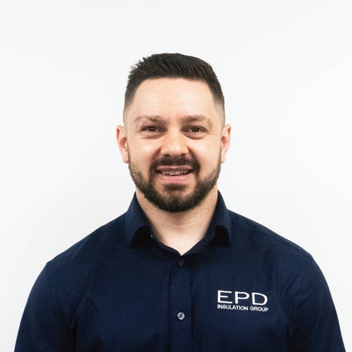 Smiling man in EPD Insulation Group uniform.