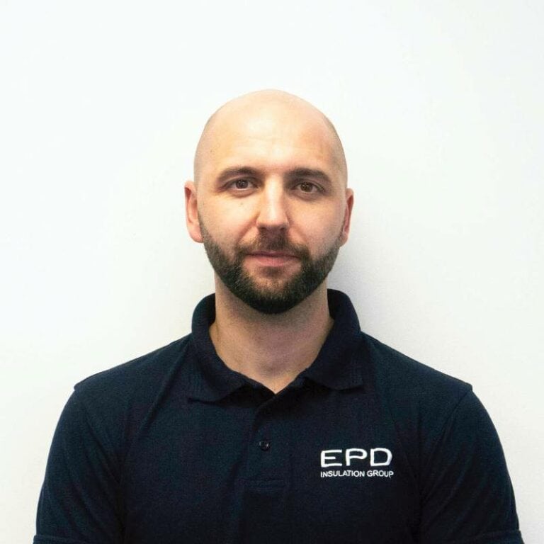 Bald man in EPD uniform against white background.