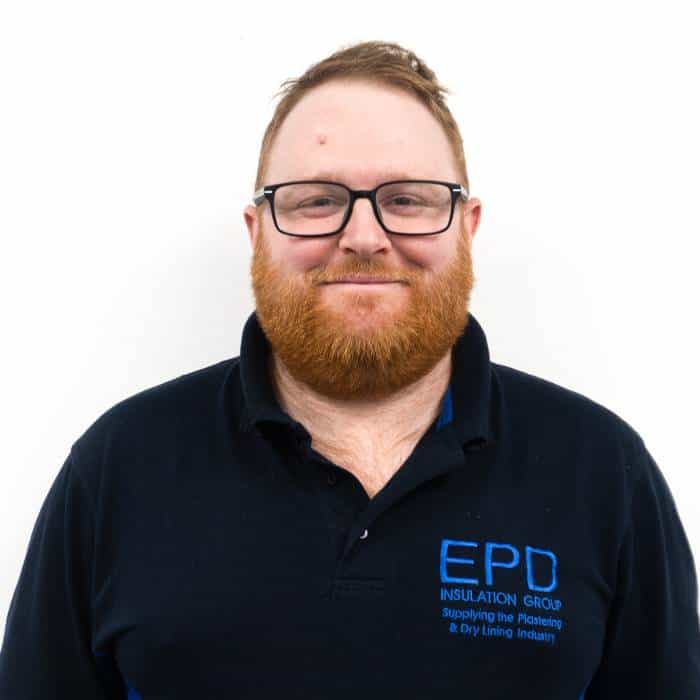 Smiling man in branded work polo shirt.