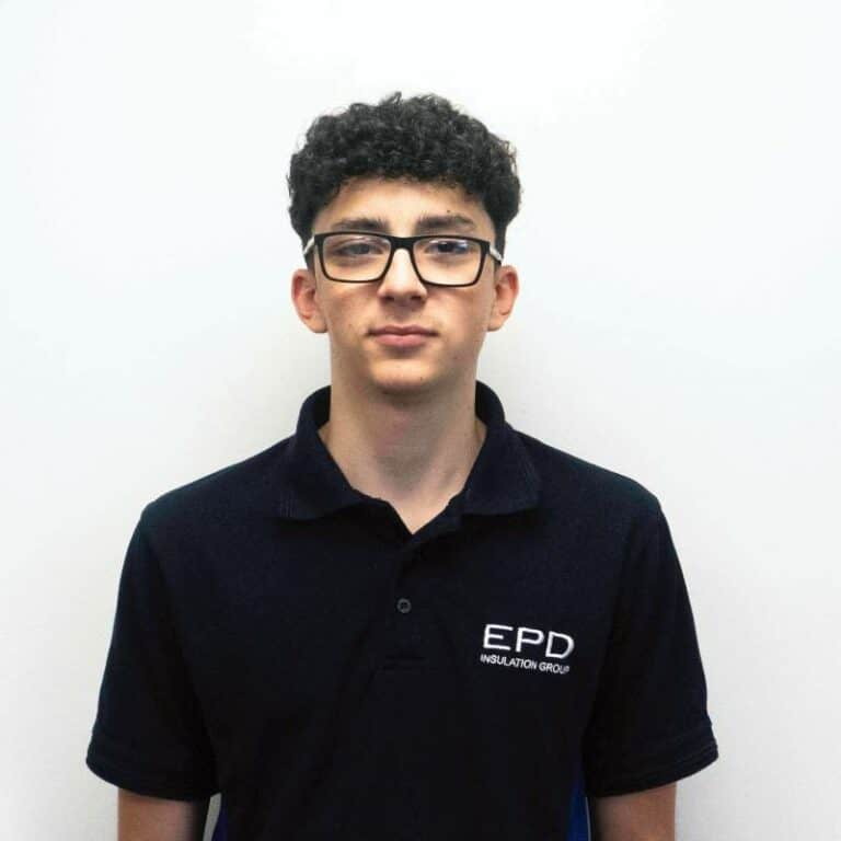 Young man in EPD uniform against plain background.