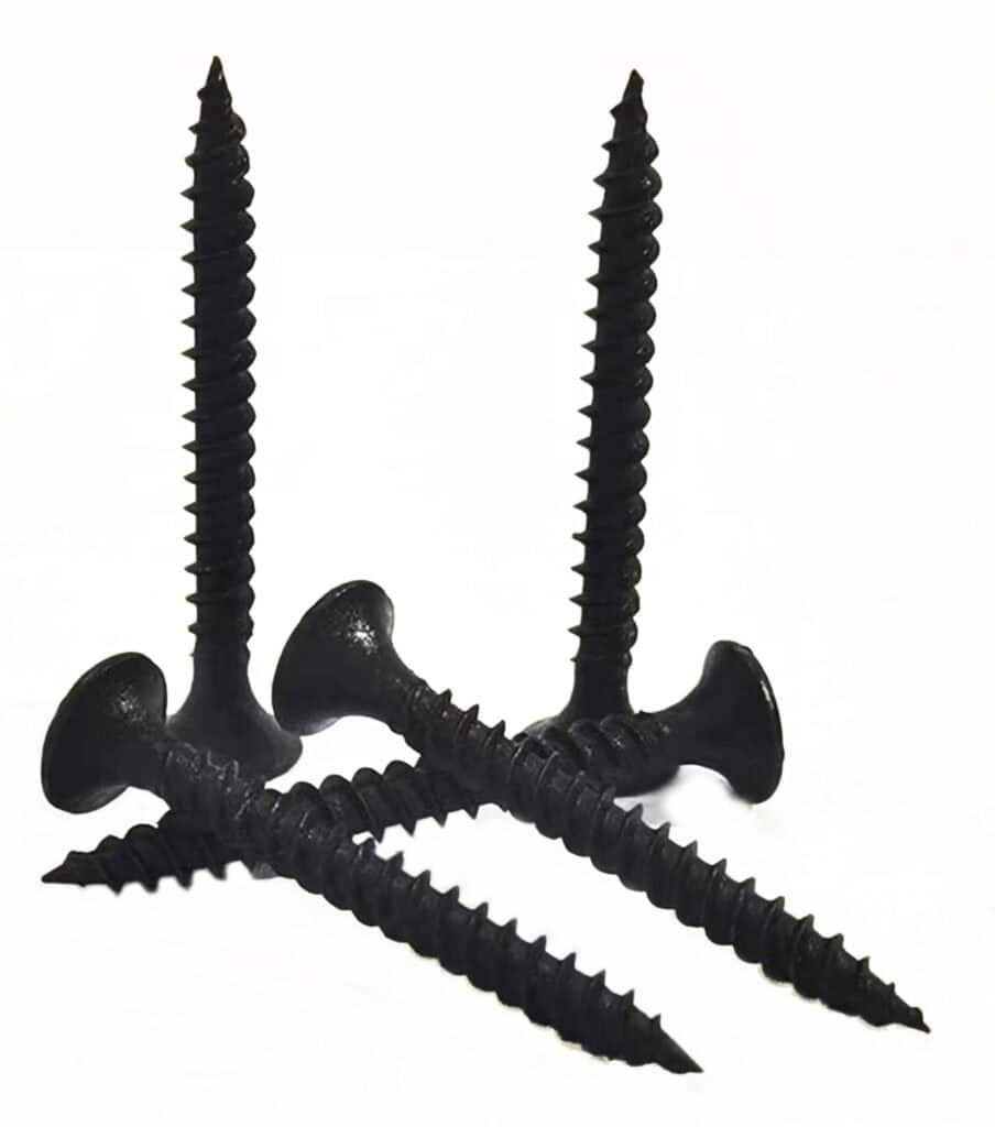 Black wood screws on white background