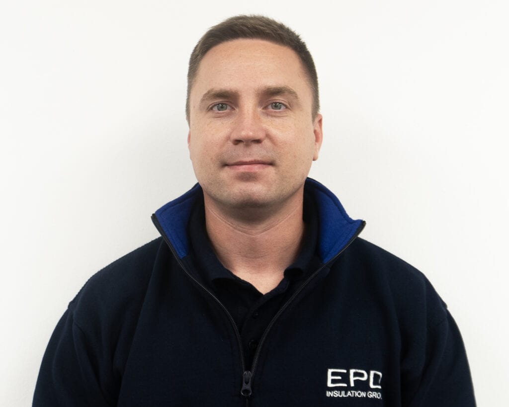 Man in EPD Insulation Group uniform smiling