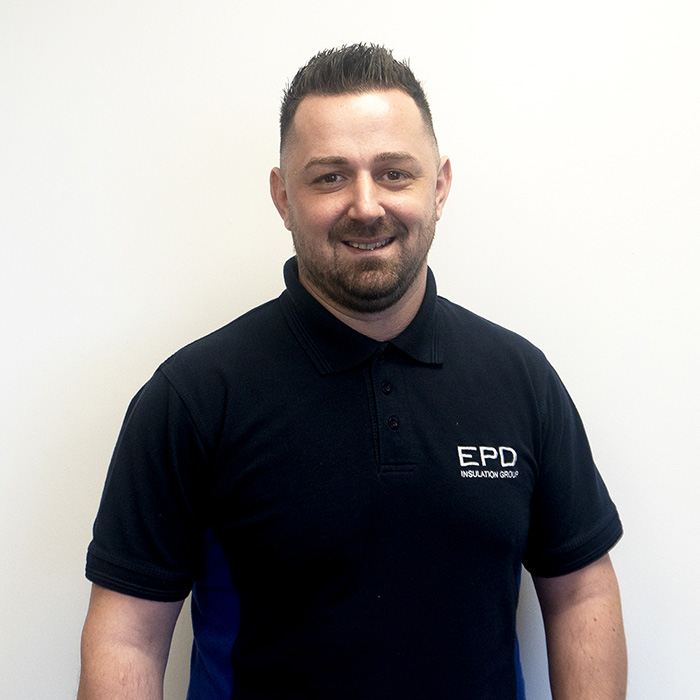 Man smiling in EPD branded polo shirt